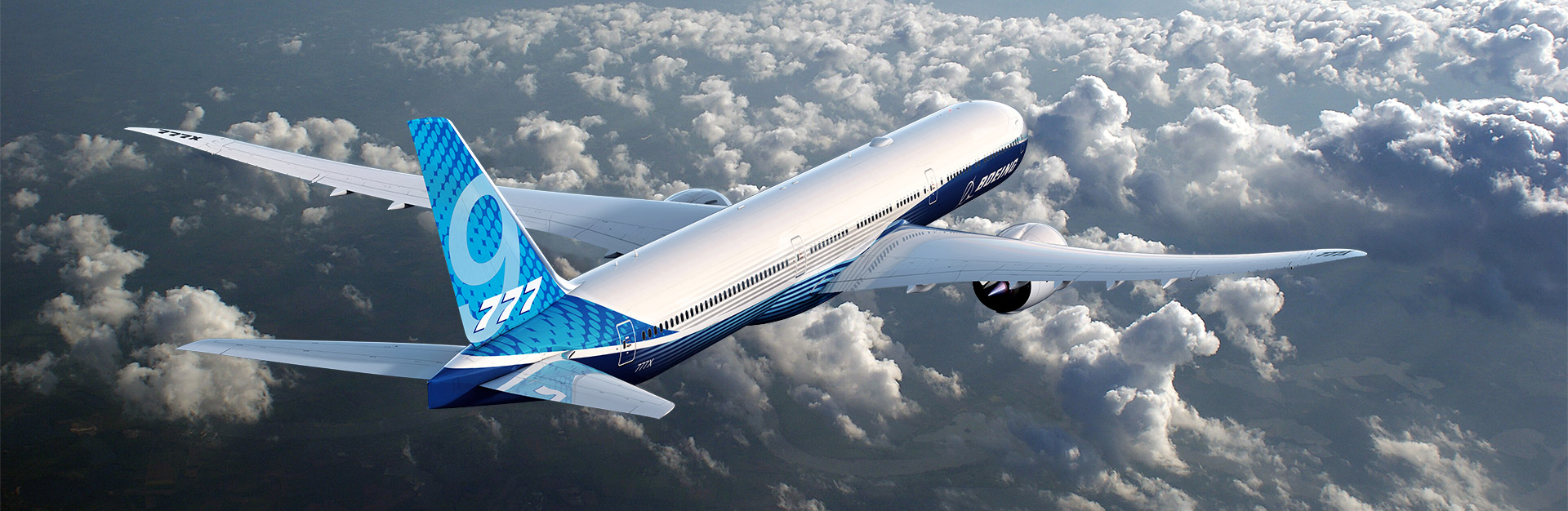 A Boeing 777-9 aircraft flying above the clouds.