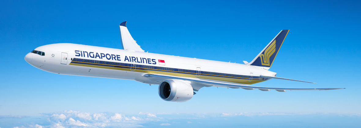 A Singapore Airlines Boeing 777 aircraft flying above clouds in a blue sky.